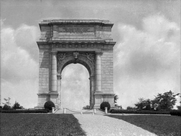 Front view of the United States Memorial Arch, completed in 1917.  The arch was designed by Paul Philippe Cret, and exhibits the neoclassical style.  The arch reads, "Naked and starving as they are, we cannot enough admire the incomparable patience and fidelity of the soldiery."