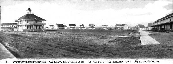 A view of the Officers' Quarters at Fort Gibbon, which began operation in 1899. The main building is on the left, and other buildings surround it. Caption reads: "Officers Quarters, Fort Gibbon, Alaska."