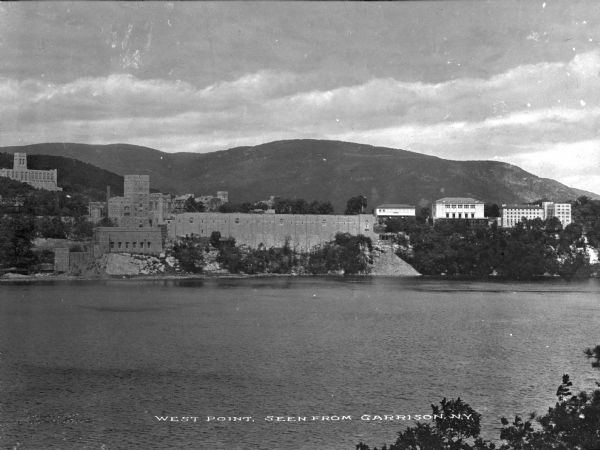 A view of West Point from Garrison, New York, across the river. The military academy was designed in l778, and was built on the bank of the Hudson River. Caption reads: "West Point, Seen from Garrison, N.Y."