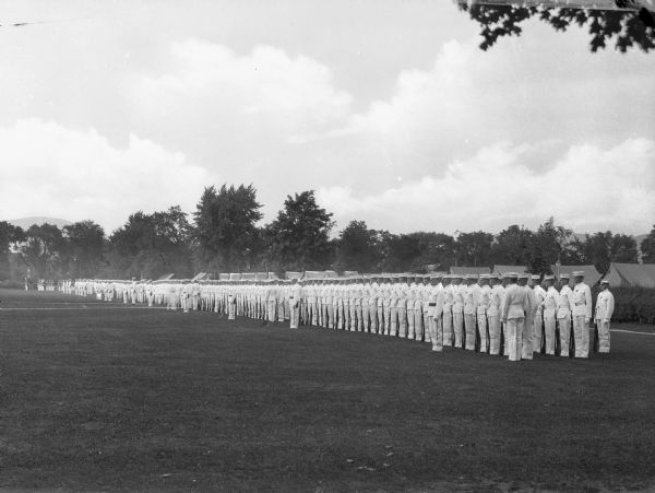A view of soldiers of the U.S. Military Academy in formation wearing summer uniforms during a parade.