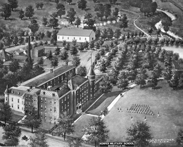 Aerial view of Kemper Military School. A formation of soldiers march in a field and a school building is on the left. Caption reads: "Kemper Military School, Boonville, MO."