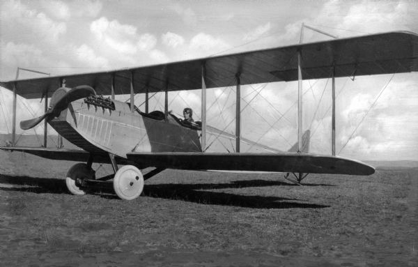 A view of man in an early twentieth century United States Army Airplane at Camp Vail, named in 1909.