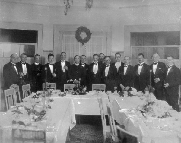 Patients pose around the dinner table at Saint Mary's Sanatorium, founded in 1880 by Bishop Salpointe.