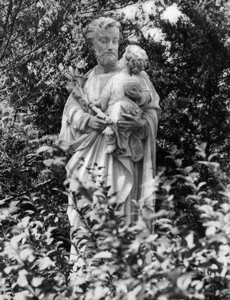View of a statue of Saint Joseph holding a child at Saint Joseph Academy of the Holy Angels, founded by the Sisters of St. Joseph on September 15, 1931.