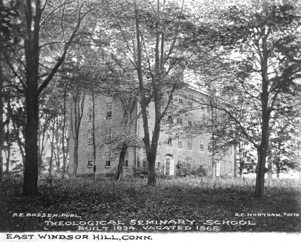 View of the Theological Seminary, built in 1834, vacated in 1865. The building stands in a wooded area. Caption reads: "Theological Seminary School, Built 1834. Vacated 1865."