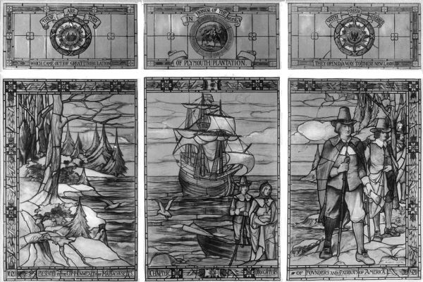 View of a stained glass window erected in 1920 in honor of the women of Plymouth Plantation.  On the center panel, a ship is in the bay while a man and woman reach the shore.  The right panel shows two men exploring the land.  Text on the bottom frame reads: "Presented by the Commonwealth of Massachusetts Chapter - Daughters of Founders and Patriots of America."