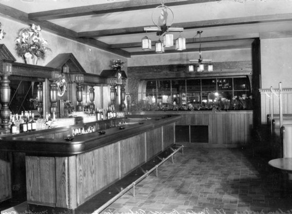 A bar and several booths stand inside the Tudor Room at the Arlington Inn.  Construction began on the establishment in 1896.