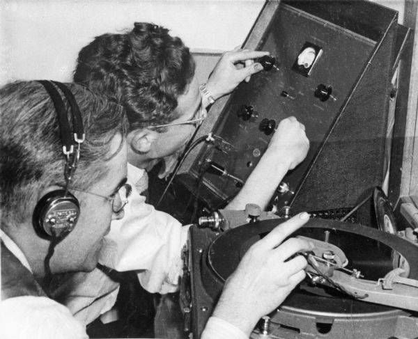 Two men use radio equipment at the transcription facilities in Campus Radio Studio at Westminster College. The college was founded in 1852.