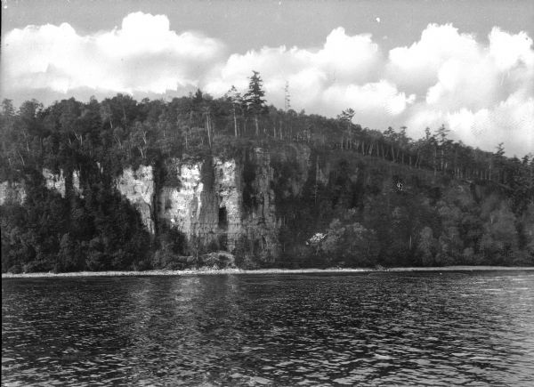 View across water towards Eagle Cliff at Peninsula State Park, established in 1910.