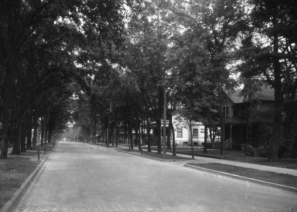 View down Main Street in a residential area. The street consisted of asphaltic concrete on old macadam.
