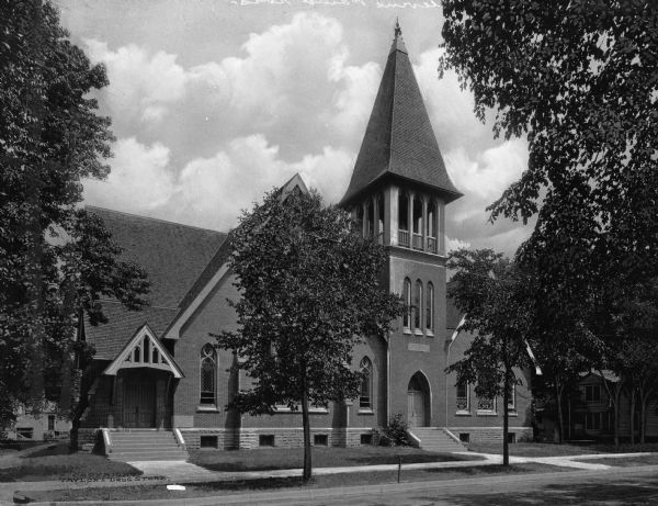 Exterior of First Presbyterian Church, built in 1892. The church features a large tower over its main entrance.
