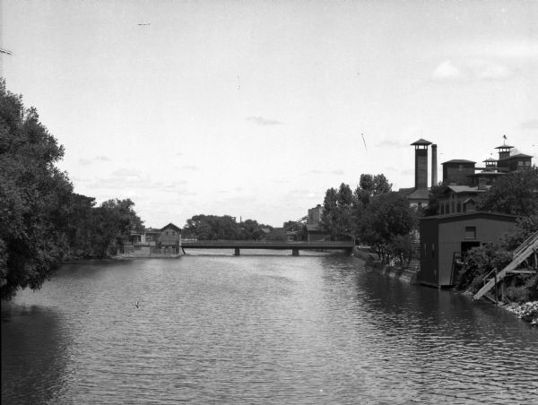 View of Rock River from Main Street Bridge. Hartig Brewery, opened in 1884, is along the right shoreline.
