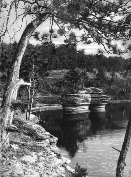An elevated upstream view of a rock formation in the Wisconsin River known as The Ink Stand.
