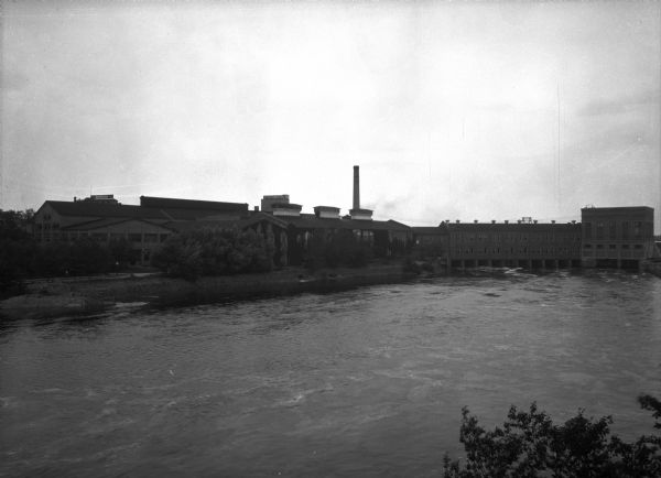 Elevated view across the Wisconsin River toward the Consolidated Water Power Company.