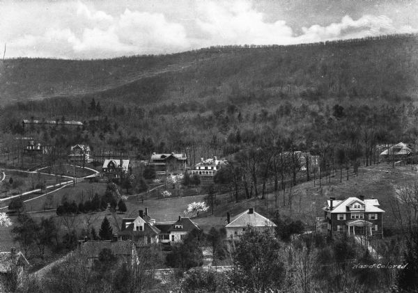 Elevated view of a colony of residences in a mountain setting.
