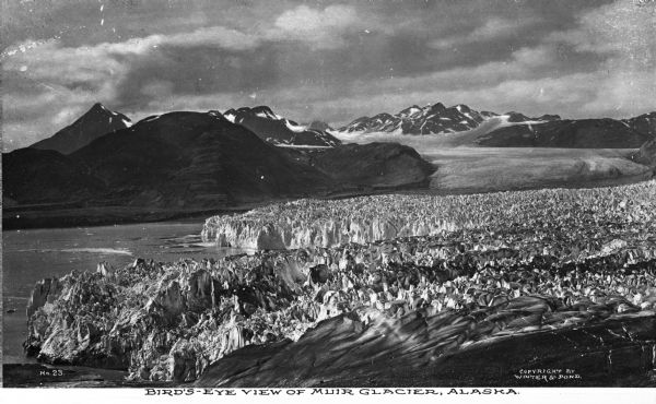 Elevated view of Muir Glacier, discovered by John Muir in 1879. Caption reads: "Bird's-Eye View of Muir Glacier, Alaska."
