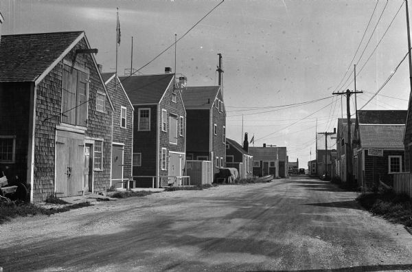 View down a street with storage buildings at Old North Wharf.