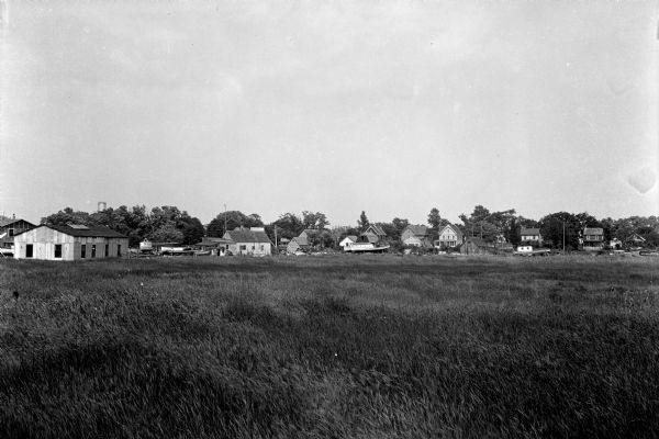 View of town houses across a field.