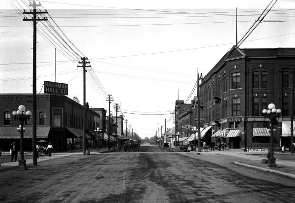 View down Main Street featuring Rathman Hall Company and small businesses.