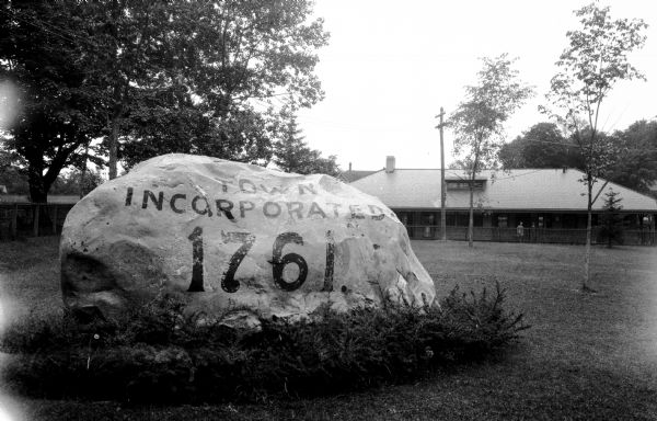 View of a large rock commmemorating the founding of the town.  Text on the rock reads, "Town Incorporated 1761."