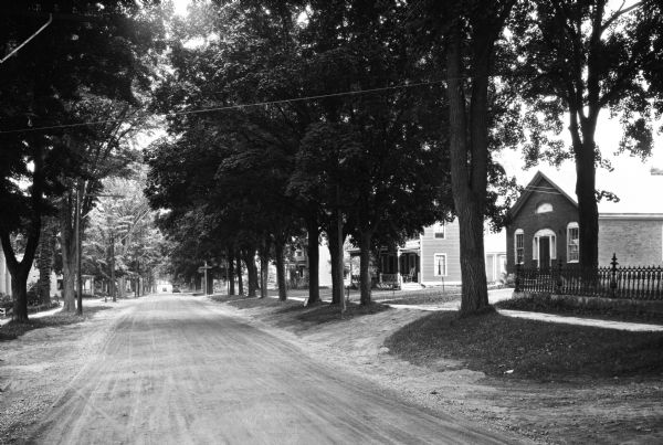 View down Main Street, a tree-lined residential area.