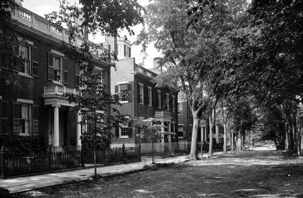 View of the Starbuck residences, three brick dwellings build by Christopher Caper from 1837 to 1840 in the Federal-Greek Revival Style.  The buildings were commissioned by Joseph Starbuck for his three sons.