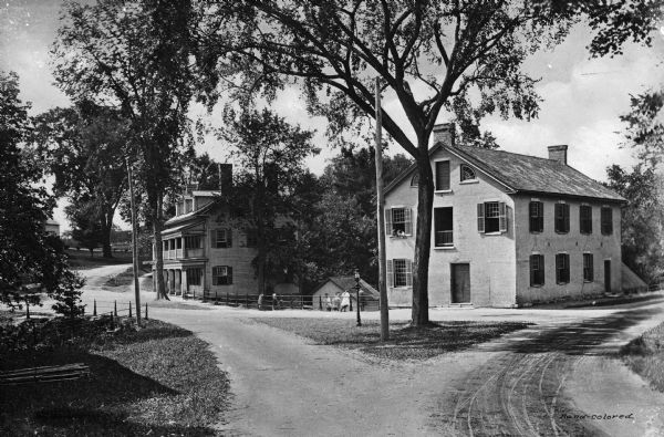 View of St. Helen's Home and other colonial homes in a residential setting.