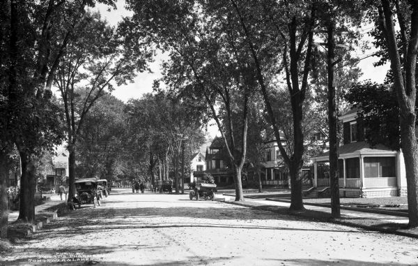 View down Washington Street, a fashionable, tree-shaded residential section of town.  Published by Priest's Pharmacy, Toms River & Lake Hurst, NJ.