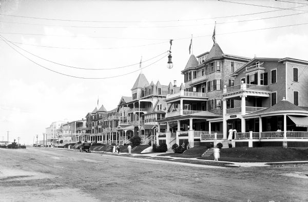 View down Fourth Avenue, lined with a row of high Victorian style rooming houses.