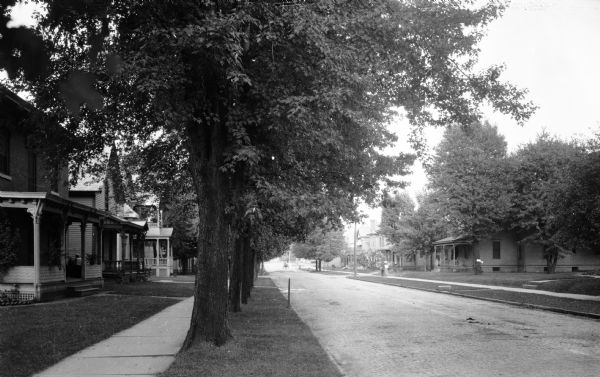 View down Rensselaer Street, lined with homes and trees.