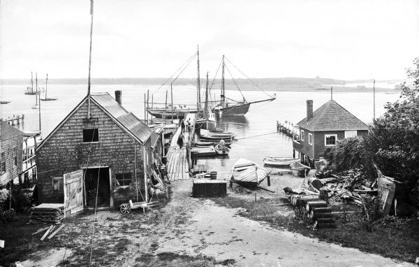 View of a small dock and fishing boats at Norton's Pier.