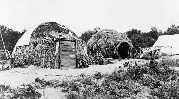 View of Apache wickiups, a domed room dwelling.