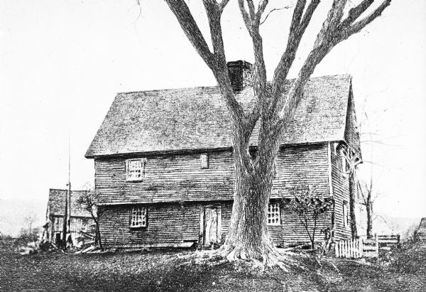 Exterior of an early American frontier farmhouse.