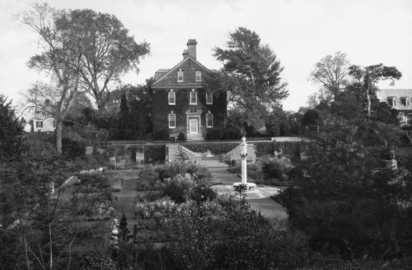 Exterior view of York Hall, also known as Nelson House, built in 1730 in the Georgian style by "Scotch Tom" Nelson.  In the foreground, the gardens can be seen.