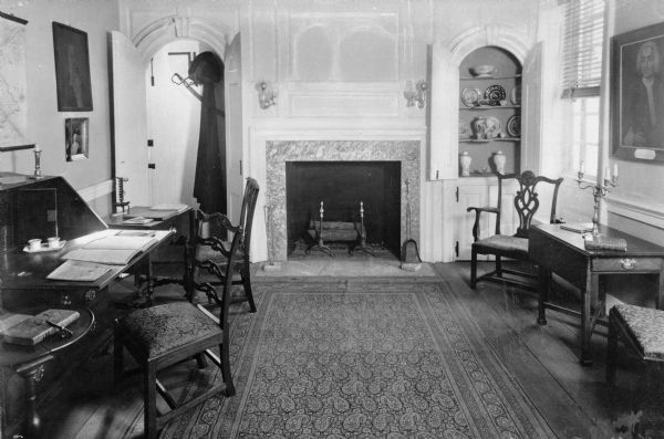Interior of Washington's headquarters, built by Isaac Potts and occupied by George Washington in 1777.  The orderly room features a fireplace and furniture.