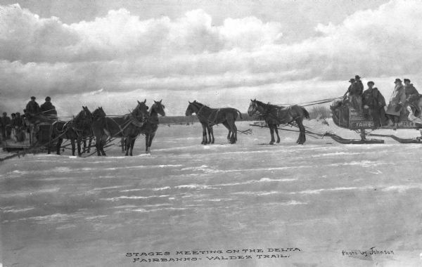 View of two stagecoaches meeting on the Fairbanks-Valdez Trail.
