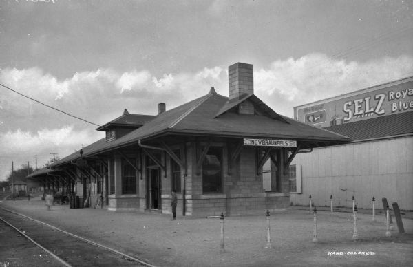 Exterior view of the New Braunfels Passenger Station for the International and Great Northern Railroad.