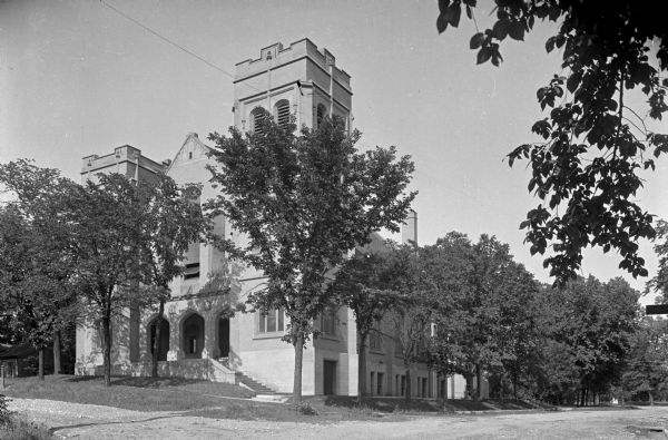 Exterior view from dirt road of the First Presbyterian Church on Prospect Street.