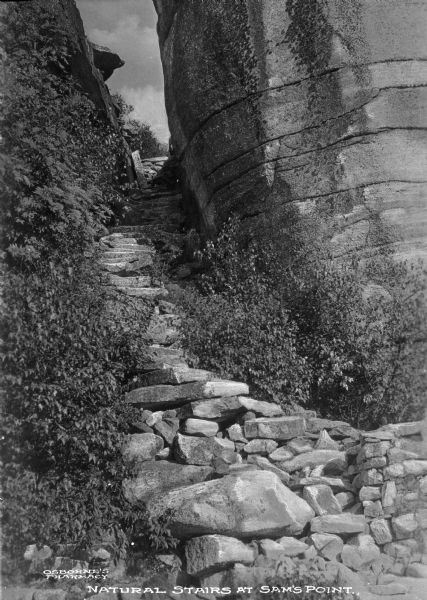 Sam's Point, a rock slide forming a natural stairway. Caption reads: "Natural Stairs at Sam's Point."