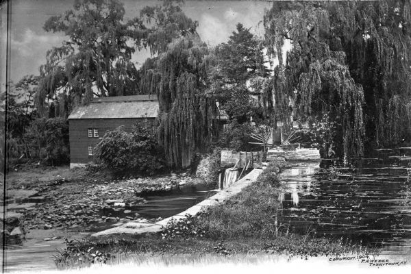 A view of the mill and pond landscape of Sleepy Hollow.