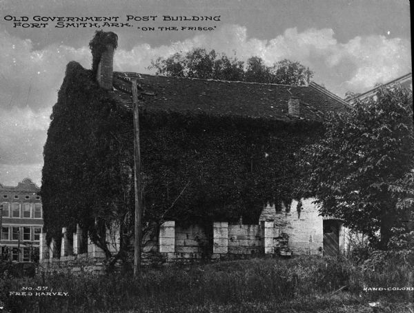 The ruins of an old stone government post building. Caption reads: "Old Government Post Building, Fort Smith, Ark. 'On the Frisco'."