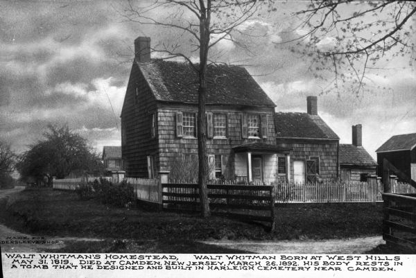 A view of the homestead poet Walt Whitman. Text below the image reads "Walt Whitman's homestead, Walt Whitman born at West Hills May 31, 1819. Died at Camden, New Jersey, March 26, 1892. His body rests in a tomb that he designed and built in Harleigh Cemetery near Camden."