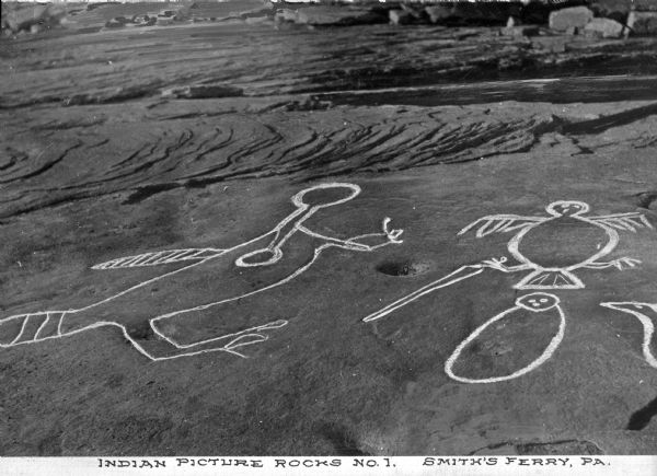 An elevated view of Native American picture rocks, also known as petroglyphs. Caption reads: "Indian Picture Rocks No. 1. Smith's Ferry, PA."