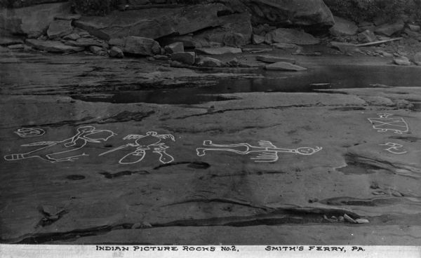 An elevated view of Native American picture rocks, also known as petroglyphs. Caption reads: "Indian Picture Rocks No. 2. Smith's Ferry, PA."