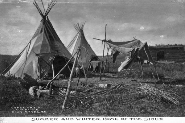 A view of Sioux Native American tepees. Caption reads: "Summer and Winter Home of the Sioux."