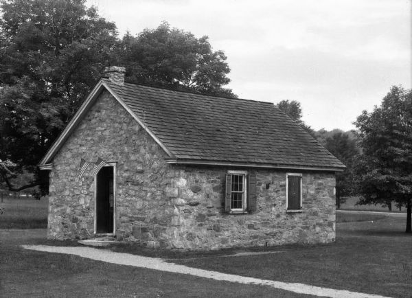 The exterior of the stone-walled "Old Camp School House."