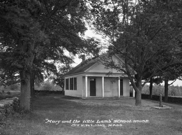 Exterior view of the school and surrounding lawn. Caption reads: "'Mary and the little Lamb' School House, Sterling, Mass."
