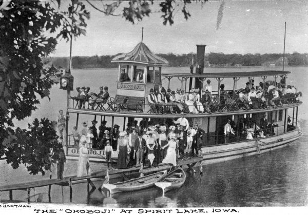 A view of the double-decked excursion boat, the "Okoboji," with many passengers on-board.