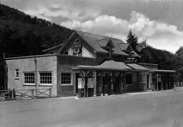 The Molino Service Station and grill on former U.S. Route 120, now Pennsylvania Route 61. Signs on the building advertise "Bar-B-Q," "Lunch," and "Ice Cream."