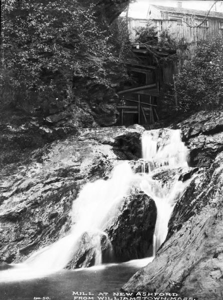 View from below of the mill at New Ashford with the waterfall below. Caption reads: "Mill at New Ashford from Williamstown, Mass."
